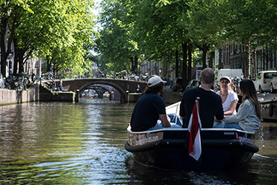 Green boat of Canal Motorboats in Amsterdam boat